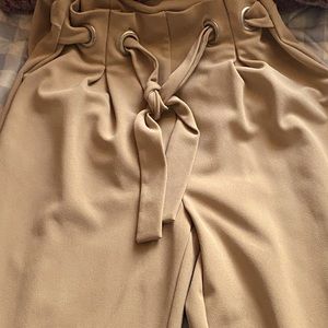 Jumpsuit with a comfortable feel and comes with Adjustable belt and POCKETS!